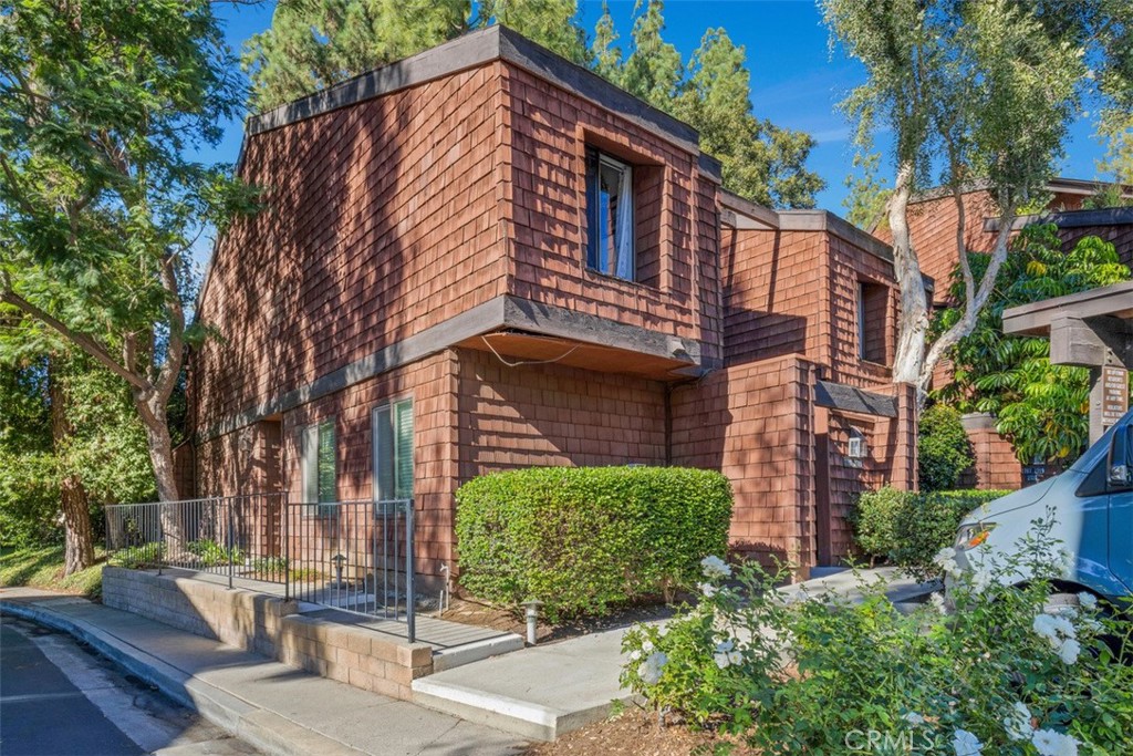 2713 Quail Ridge Circle, Unit 25 Fullerton, CA 92835 - Photo 1 of 30 a view of a building with a garden
