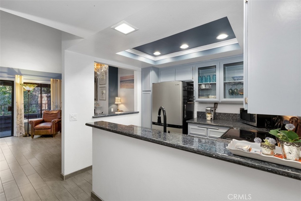 2713 Quail Ridge Circle, Unit 25 Fullerton, CA 92835 - Photo 12 of 30 a kitchen with refrigerator and sink