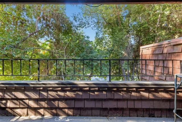 a view of balcony with wooden floor