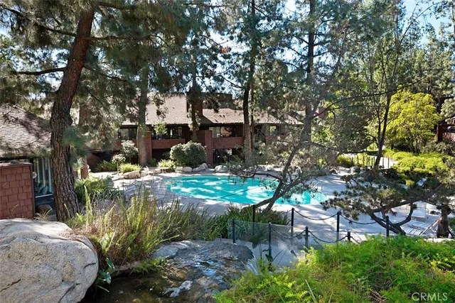 a backyard of a house with a table and chairs