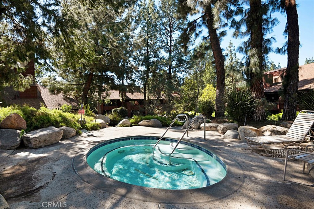 2713 Quail Ridge Circle, Unit 25 Fullerton, CA 92835 - Photo 22 of 30 a backyard of a house with a table and chairs