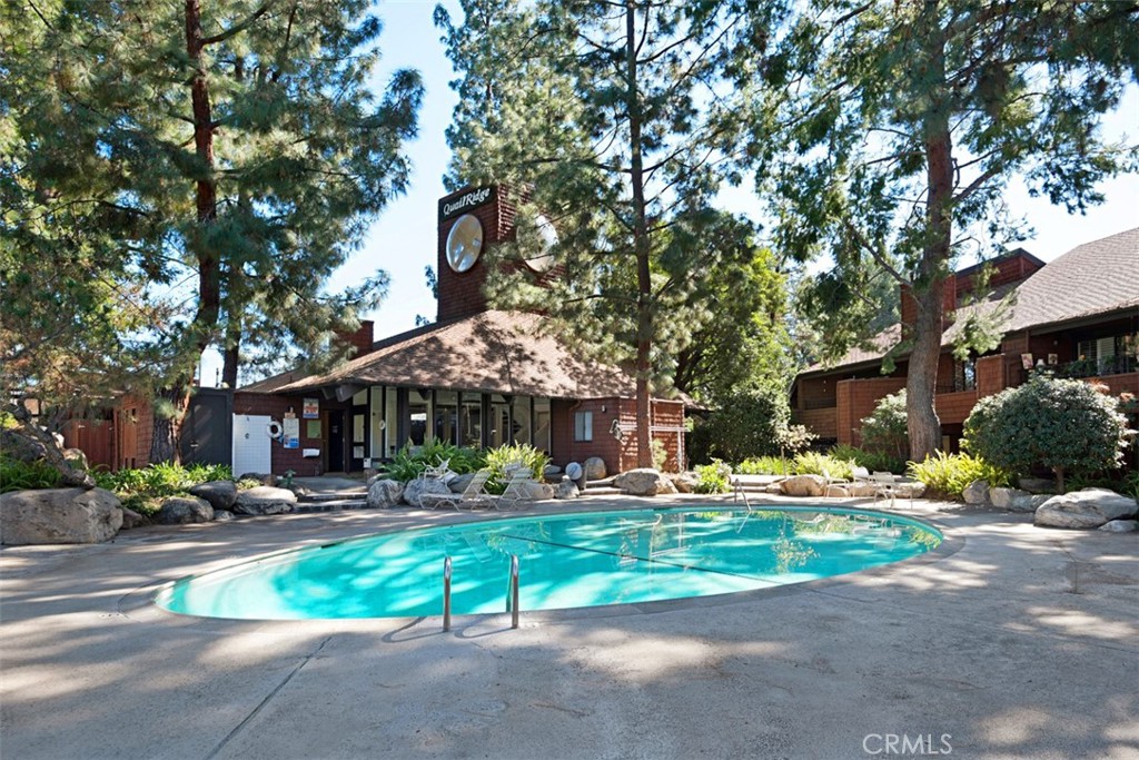 2713 Quail Ridge Circle, Unit 25 Fullerton, CA 92835 - Photo 28 of 30 a front view of a building with small yard and palm trees