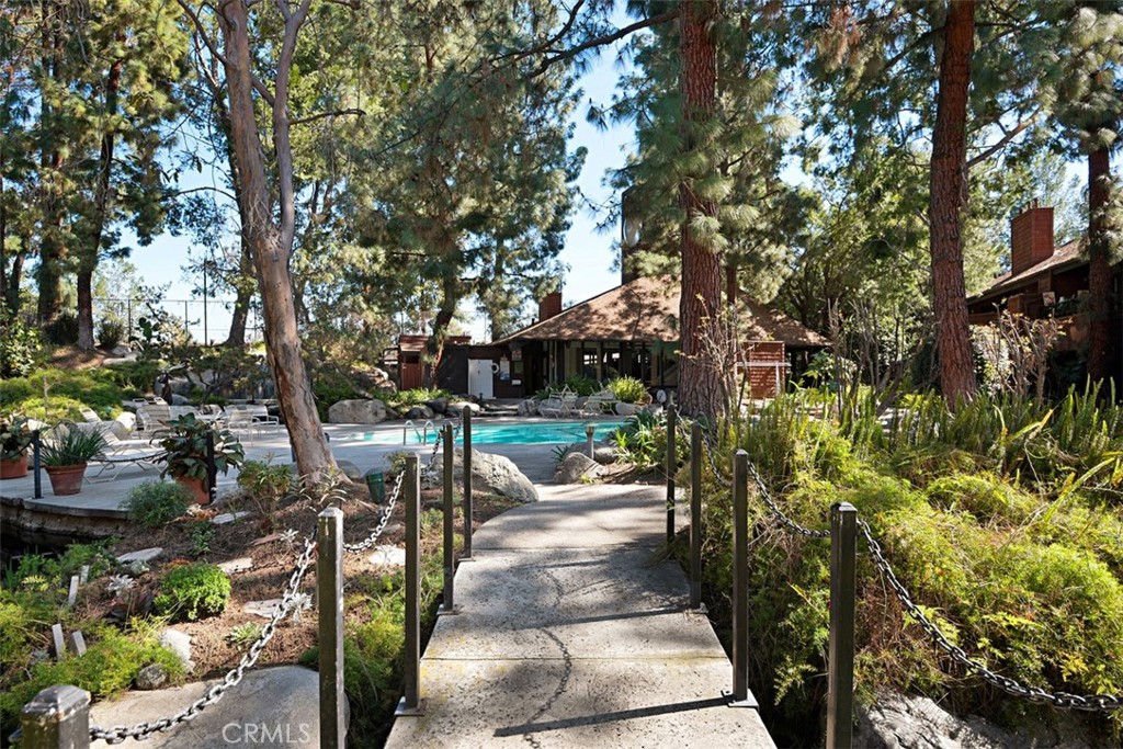 2713 Quail Ridge Circle, Unit 25 Fullerton, CA 92835 - Photo 29 of 30 a view of a patio with table and chairs and potted plants