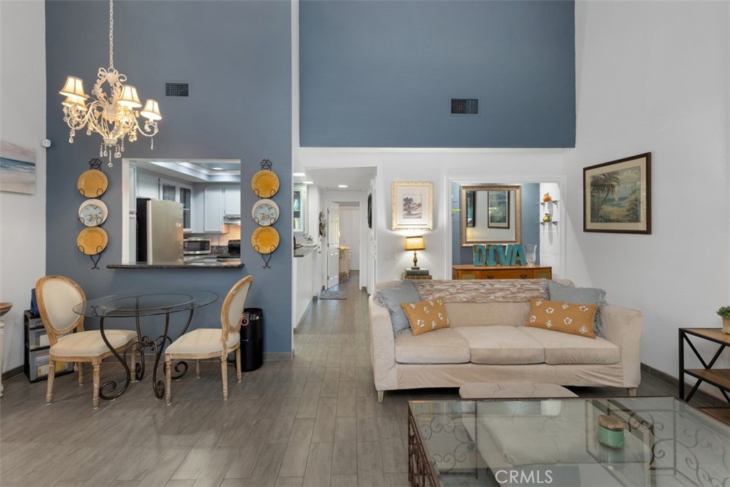 2713 Quail Ridge Circle, Unit 25 Fullerton, CA 92835 - Photo 3 of 30 a living room filled with furniture and chandelier