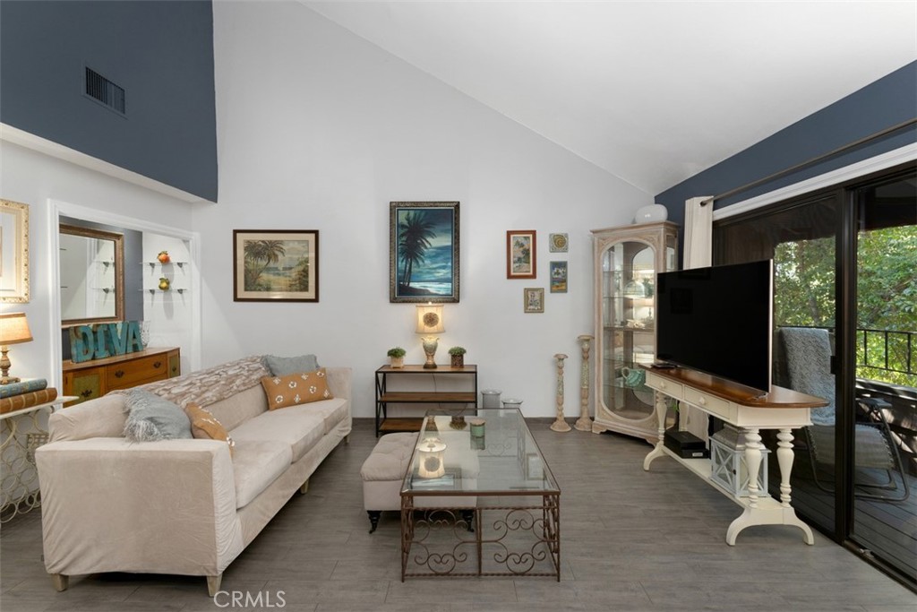 2713 Quail Ridge Circle, Unit 25 Fullerton, CA 92835 - Photo 4 of 30 a living room with furniture and a flat screen tv