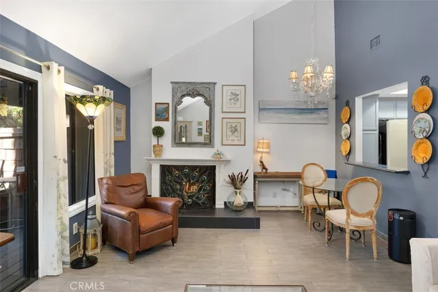 a living room with furniture and fireplace