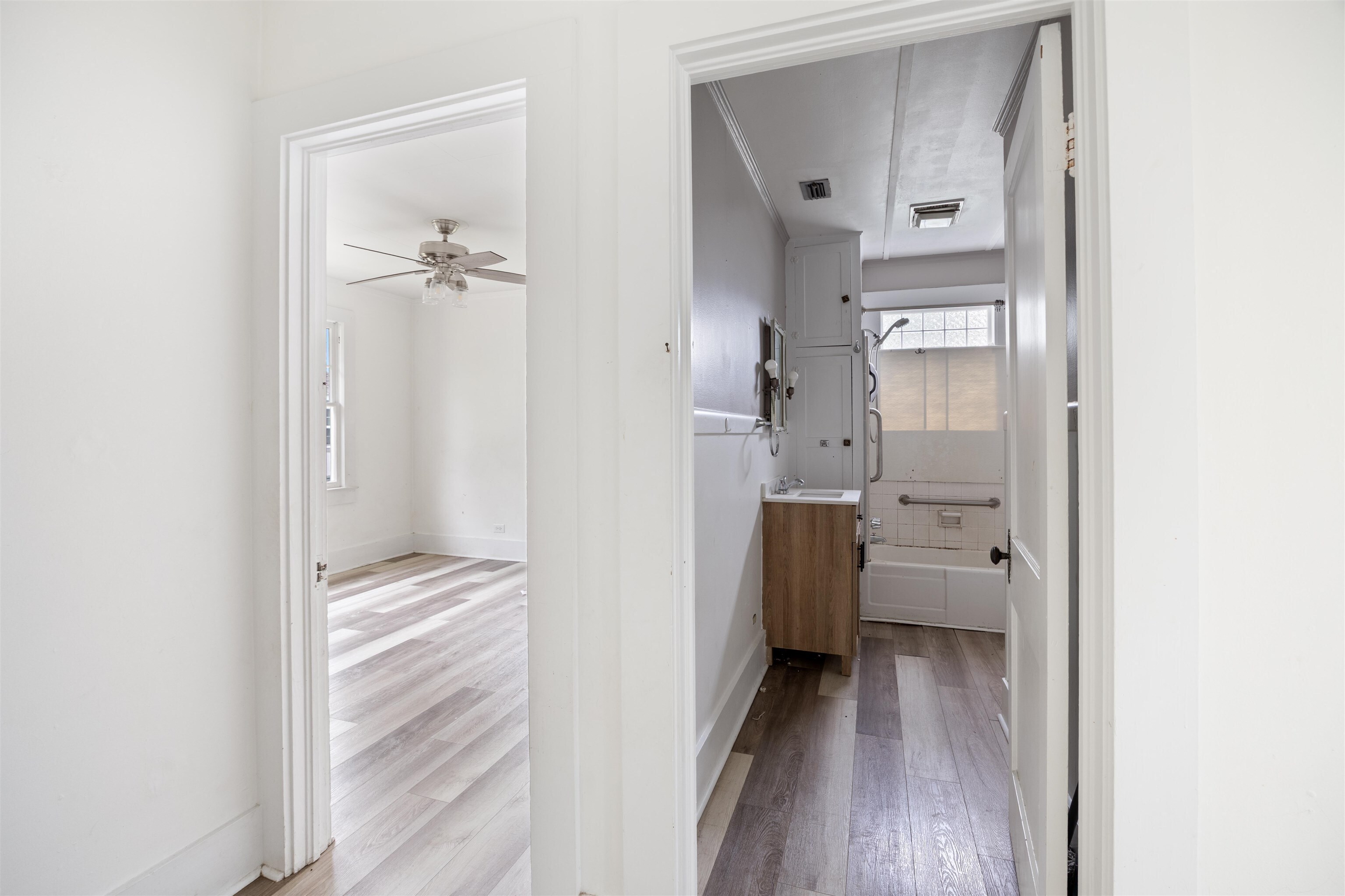 112 South Juniper Street Foley, AL 36535 - Photo 30 of 64 Corridor featuring light wood-type flooring and baseboards