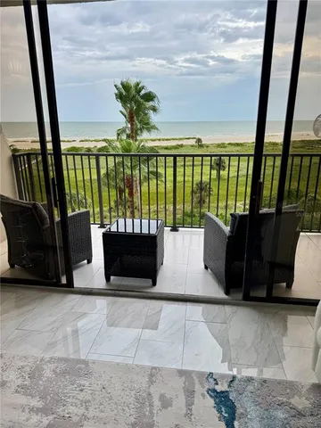 a view of balcony with furniture