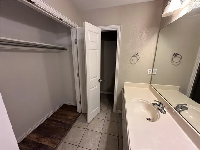 a bathroom with a tub and shower