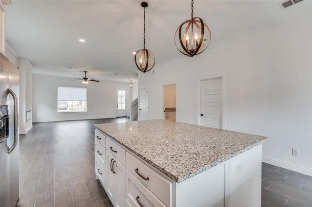 a kitchen with chandelier cabinets and chandelier