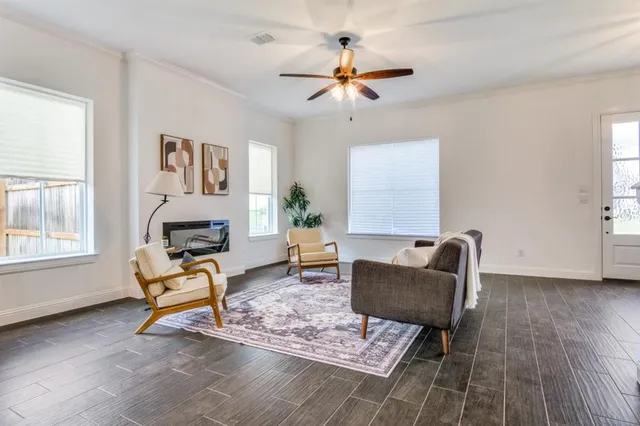a living room with furniture and a window