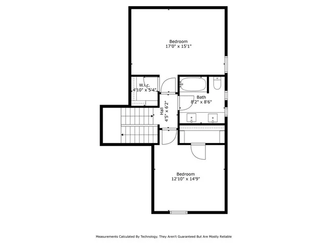 a picture of a bench in front of a wall