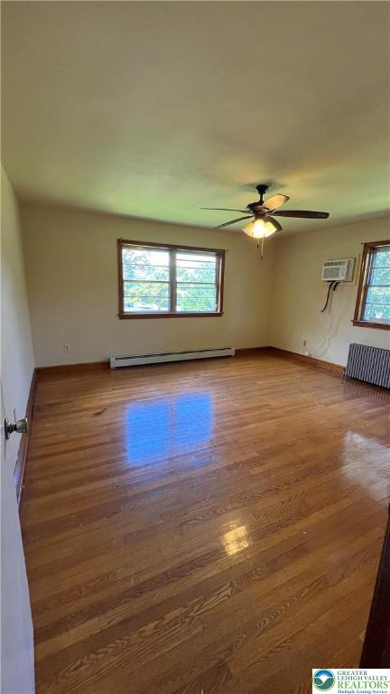 6172 Airport Road Bethlehem, PA 18017 - Photo 10 of 16 a view of an empty room with window and wooden floor