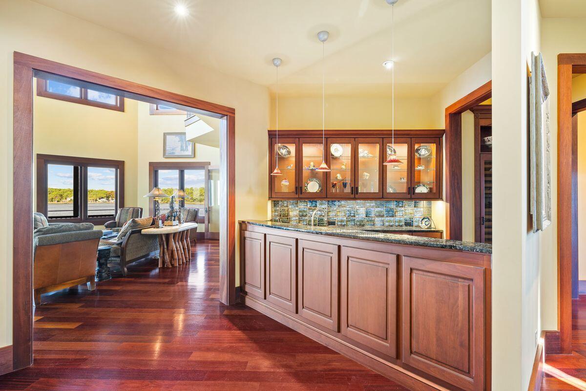 281 Grove Lane Freeport, FL 32439 - Photo 16 of 36 a living room with a large window and wooden floor