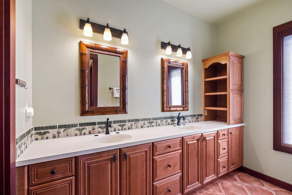 281 Grove Lane Freeport, FL 32439 - Photo 30 of 36 a bathroom with a double vanity sink and a mirror