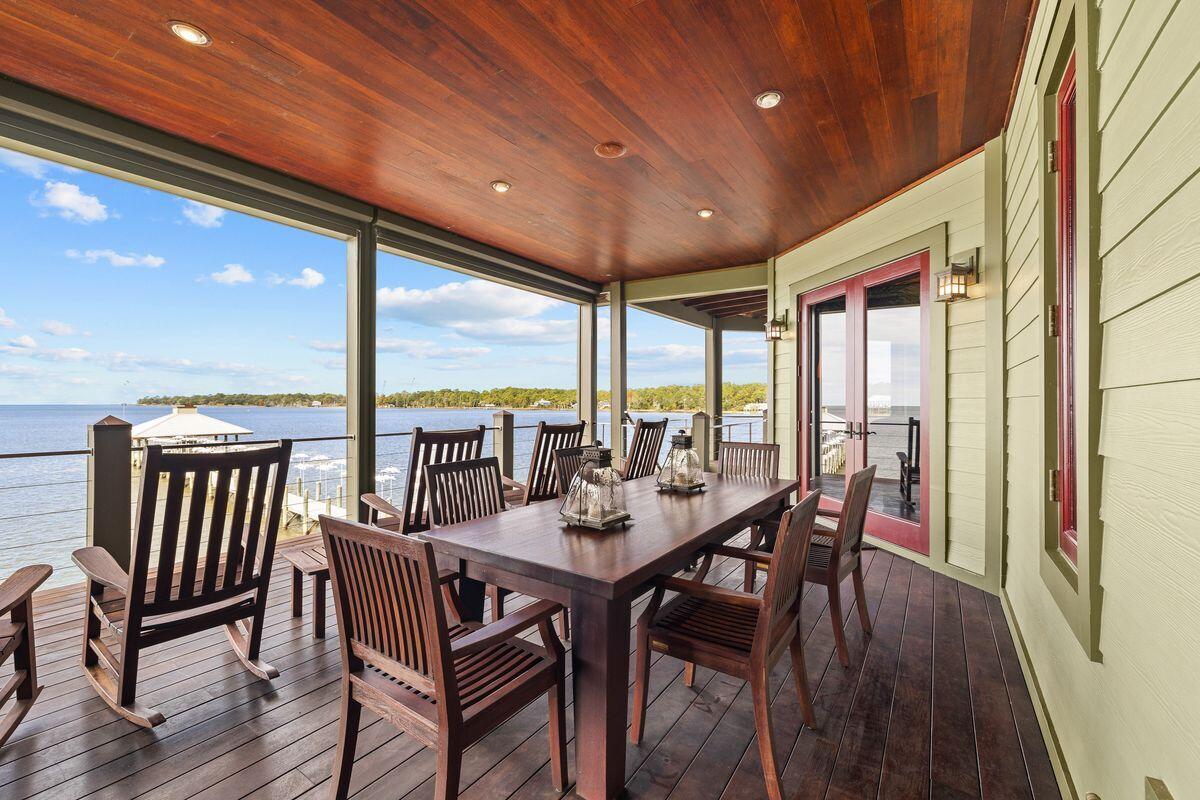 281 Grove Lane Freeport, FL 32439 - Photo 9 of 36 a dining room with furniture window and wooden floor