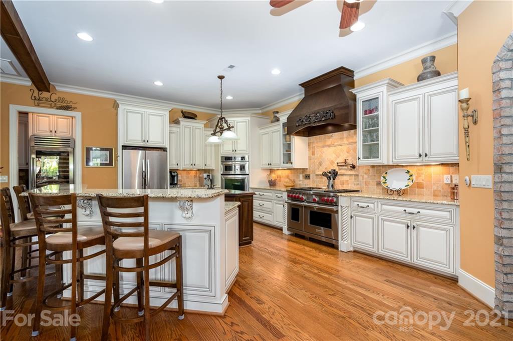 2341 Valelake Road York, SC 29745 - Photo 12 of 48 a kitchen with stainless steel appliances kitchen island granite countertop a stove and cabinets