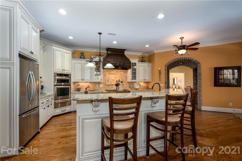 2341 Valelake Road York, SC 29745 - Photo 15 of 48 a kitchen with stainless steel appliances a dining table and chairs