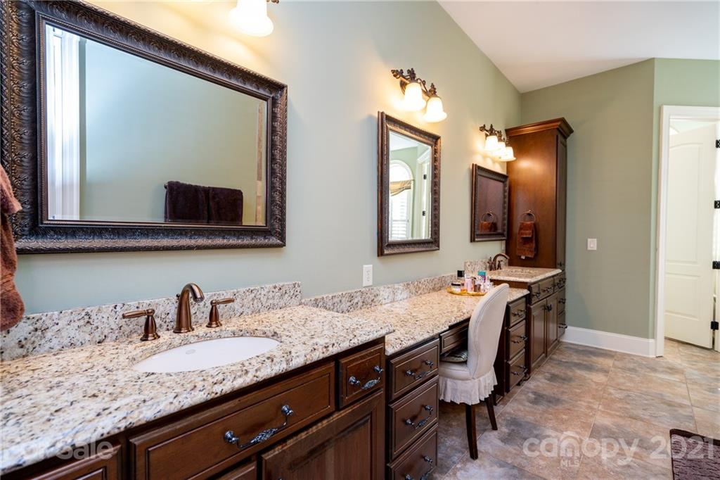 2341 Valelake Road York, SC 29745 - Photo 24 of 48 a en suite bathroom with a granite countertop sink and a mirror
