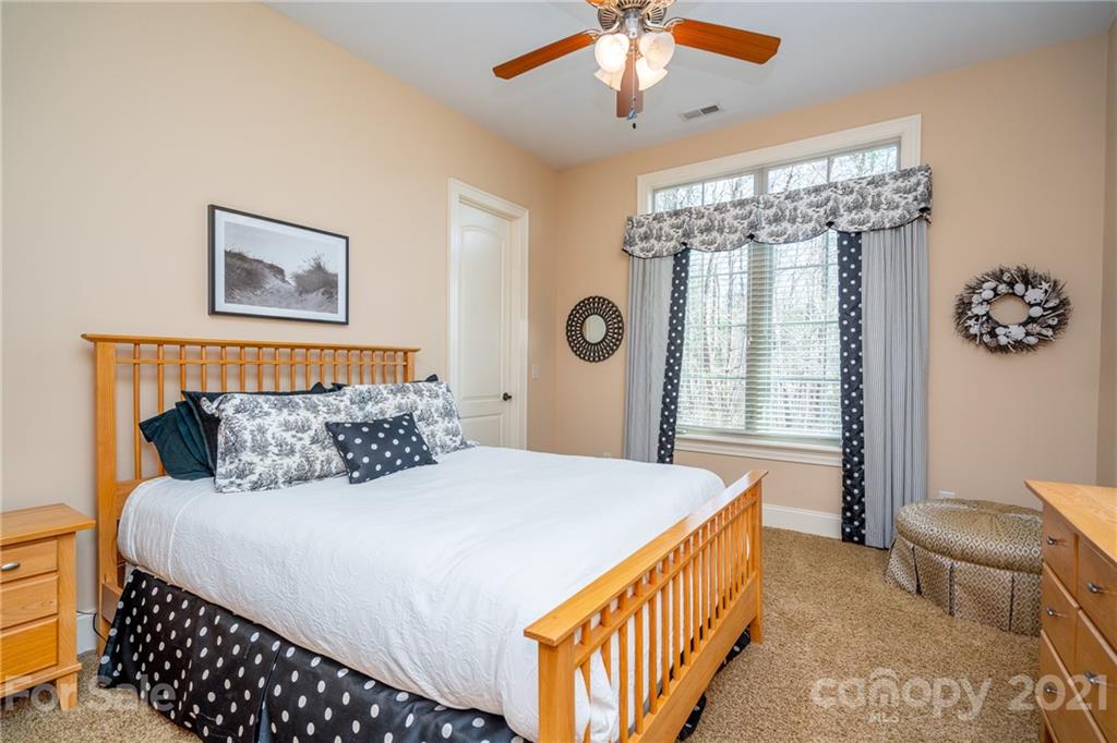 2341 Valelake Road York, SC 29745 - Photo 33 of 48 a bedroom with a large bed and a chandelier