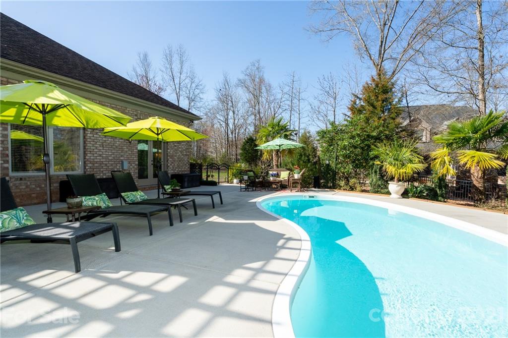 2341 Valelake Road York, SC 29745 - Photo 36 of 48 a view of a swimming pool with chairs in patio