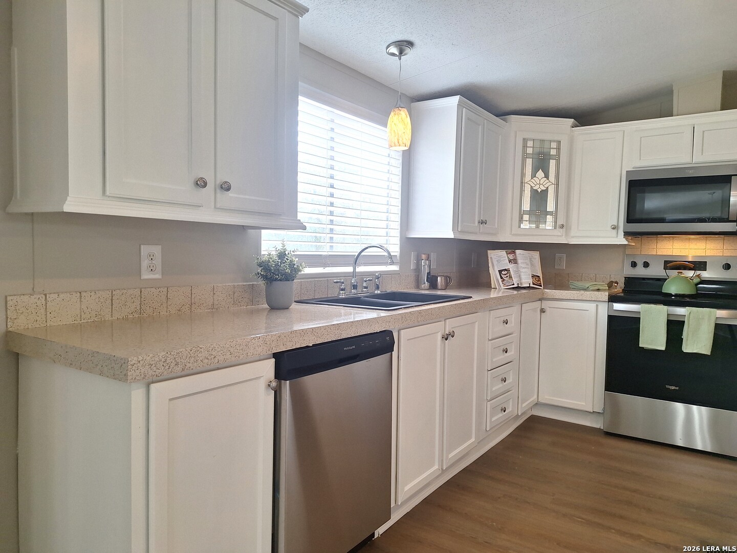 533 Las Hadas Spring Branch, TX 78070 - Photo 4 of 16 a kitchen with cabinets appliances a sink and a window