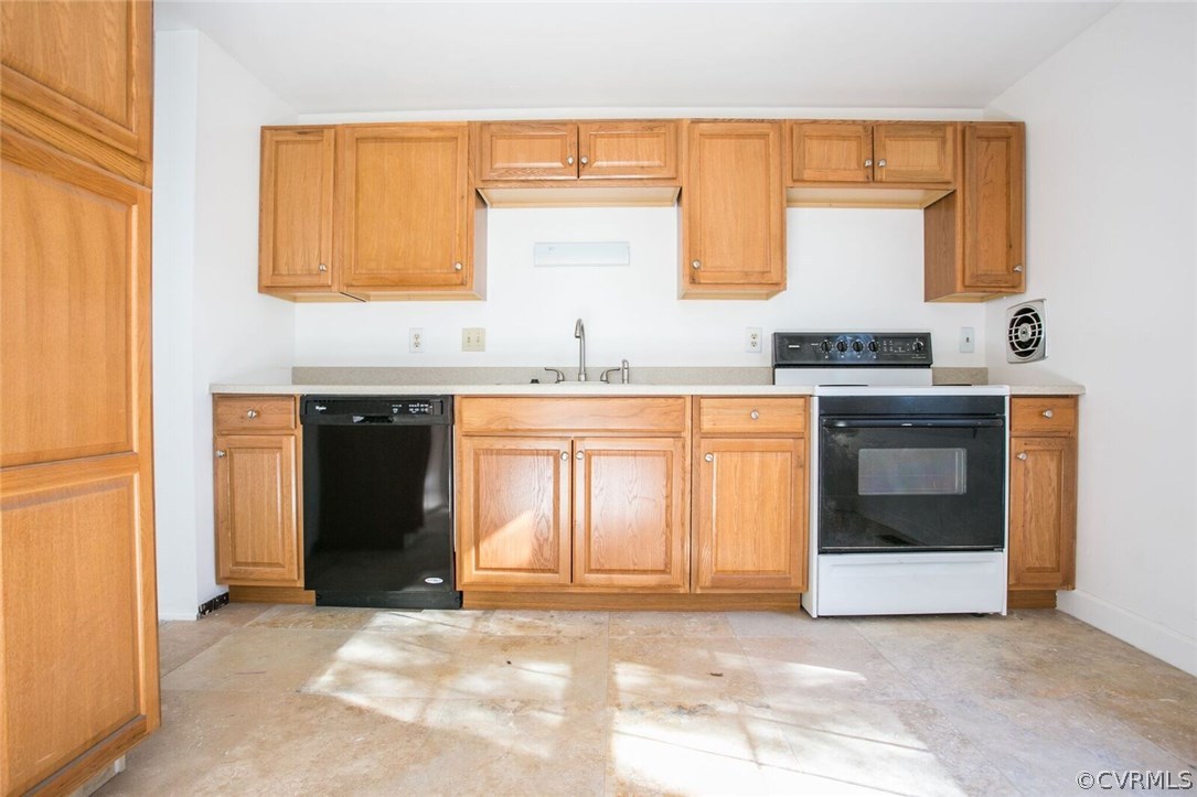 9309 Carbe Road Chesterfield, VA 23236 - Photo 8 of 21 a kitchen with granite countertop a sink and a stove