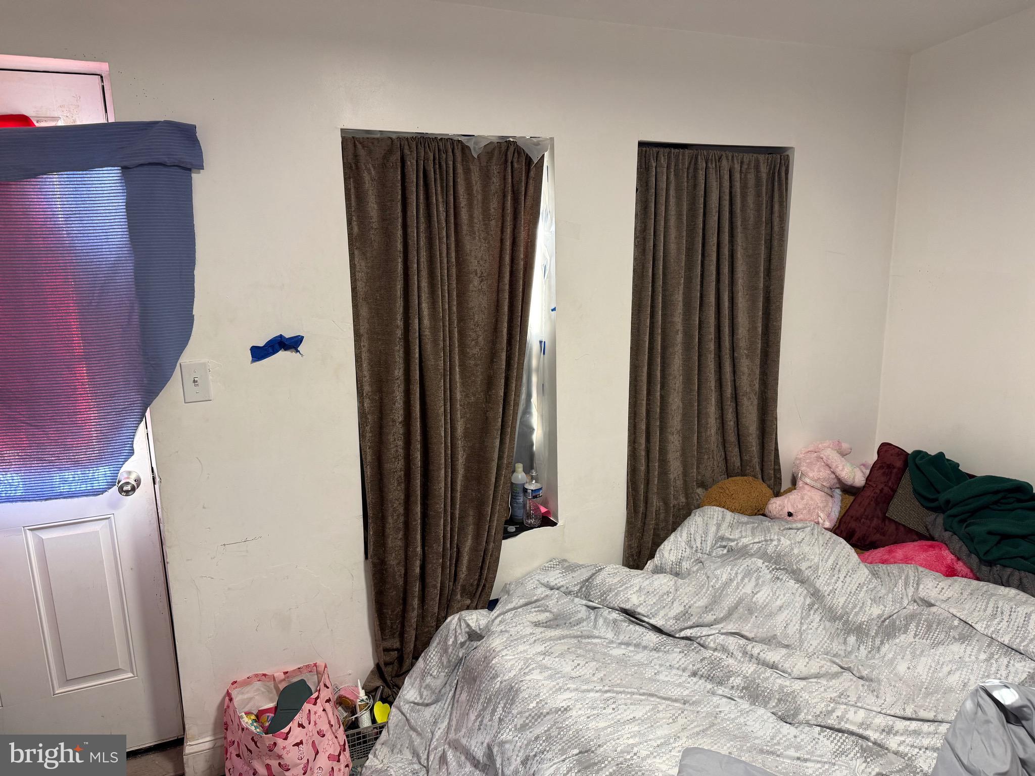 255 3rd Street Gloucester City, NJ 08030 - Photo 12 of 35 a bedroom with a bed and a window