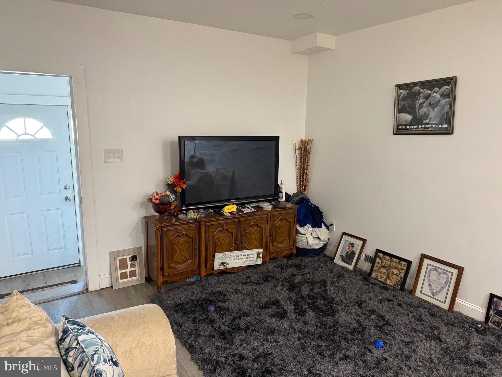255 3rd Street Gloucester City, NJ 08030 - Photo 14 of 35 a living room with furniture and a flat screen tv