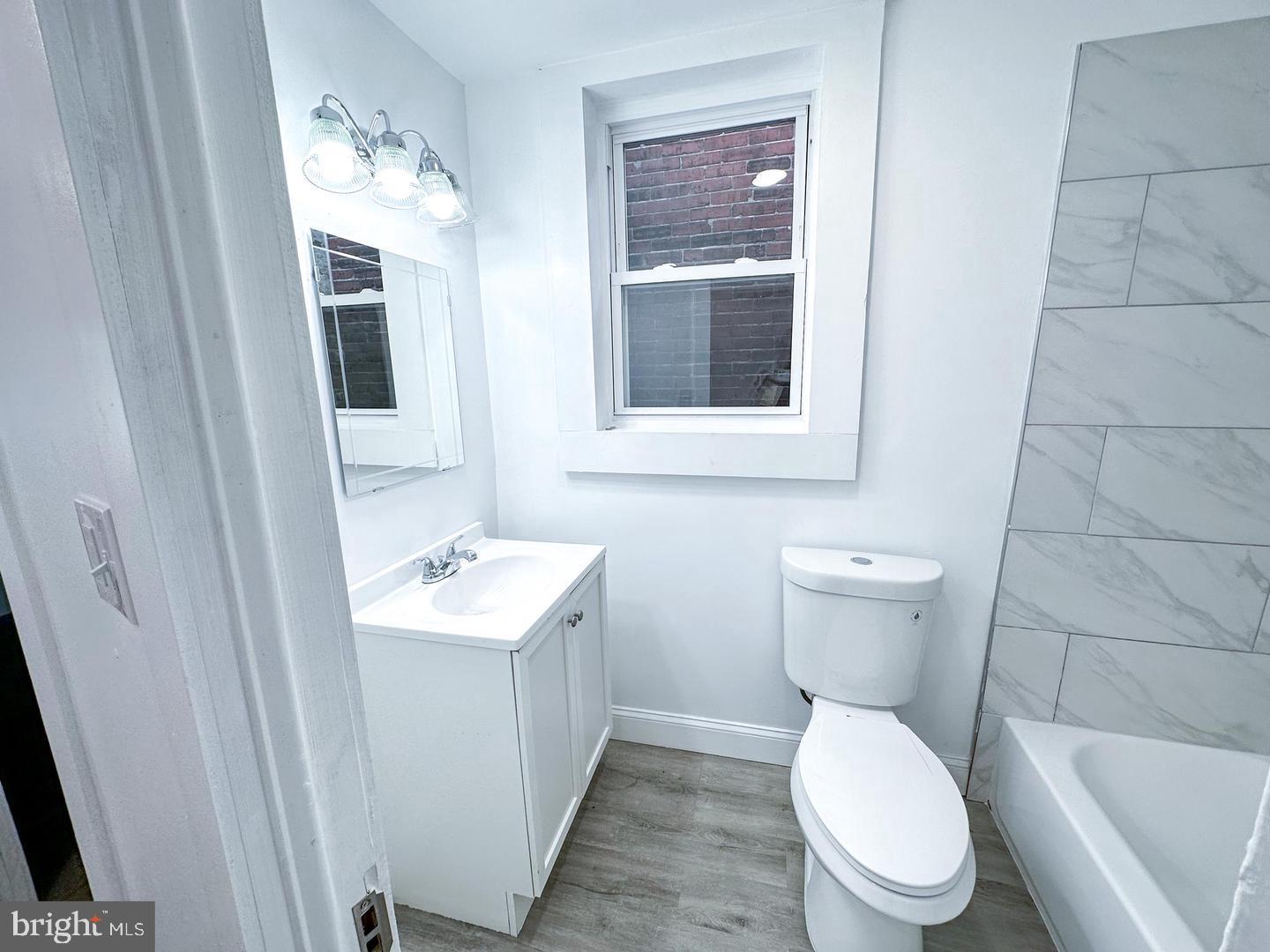 255 3rd Street Gloucester City, NJ 08030 - Photo 34 of 35 a white toilet sitting next to a bathroom sink