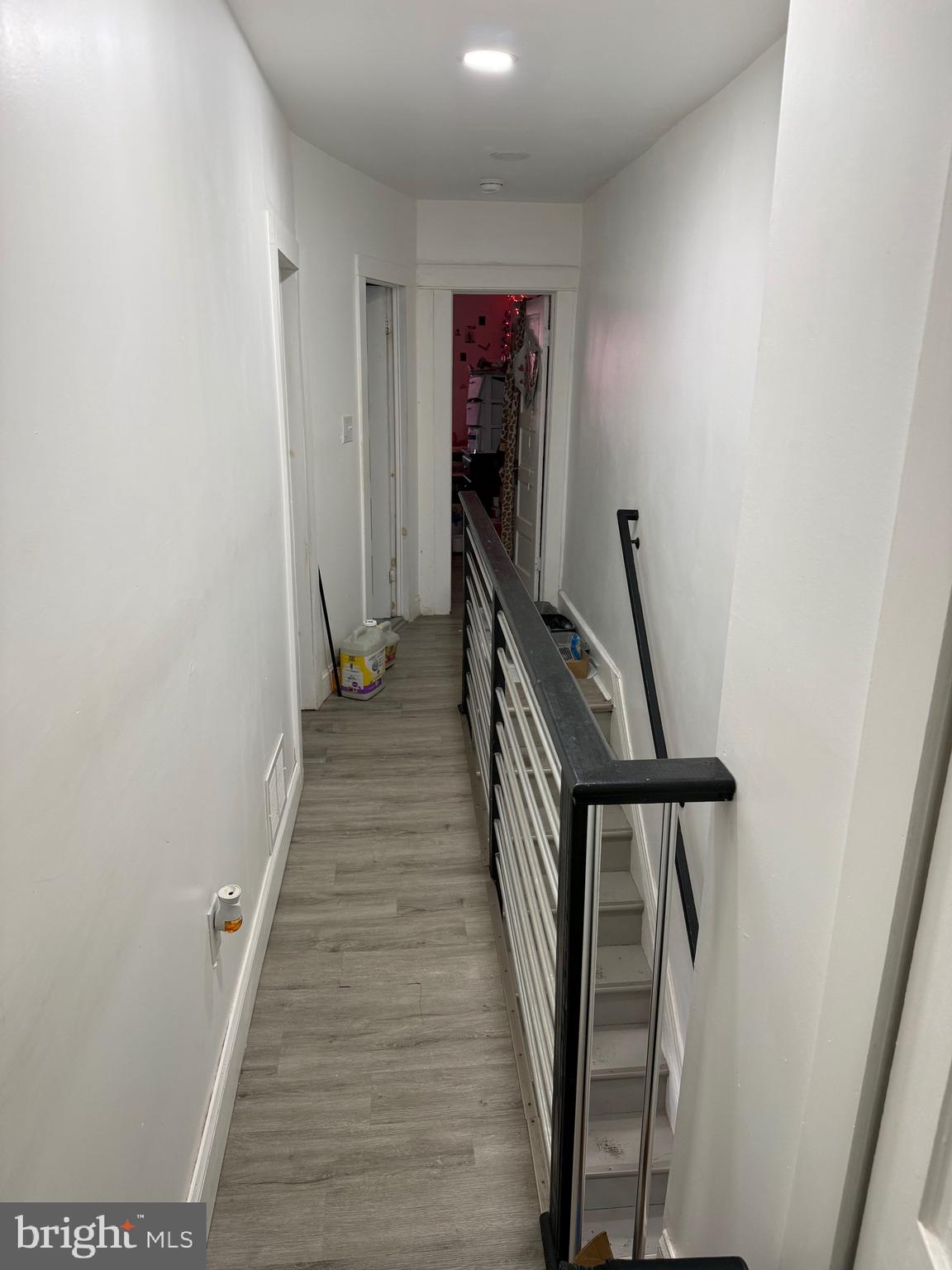 255 3rd Street Gloucester City, NJ 08030 - Photo 4 of 35 a view of a hallway with wooden floor and stairs