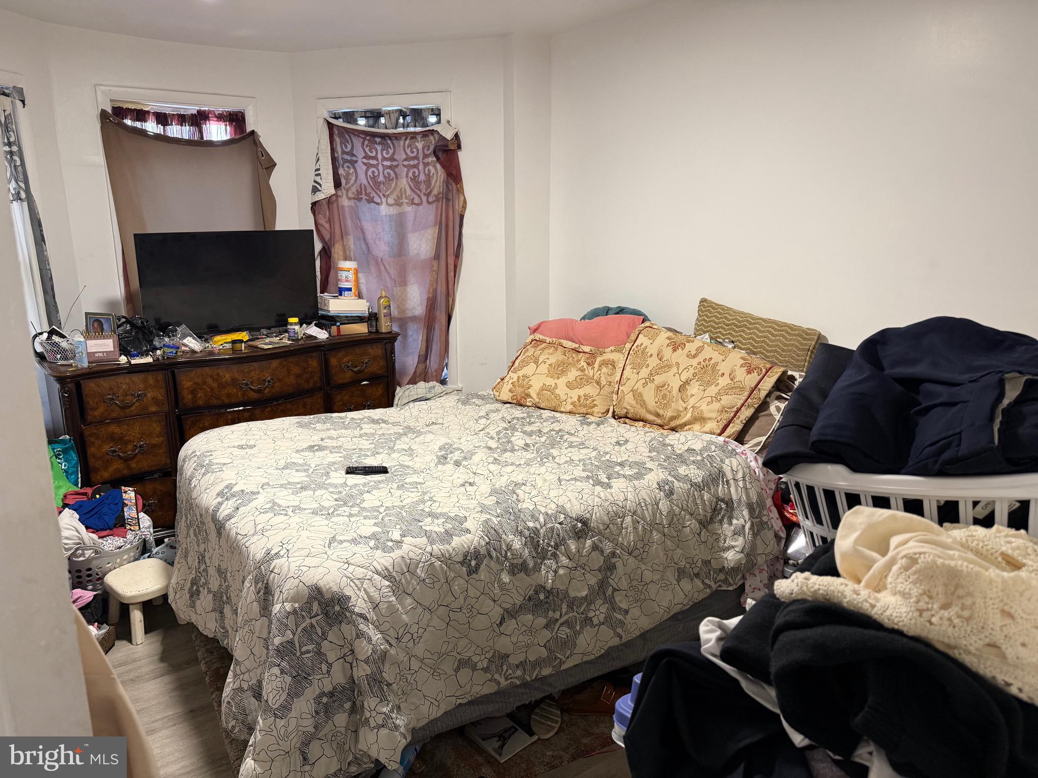 255 3rd Street Gloucester City, NJ 08030 - Photo 5 of 35 a bed sitting in a bedroom next to a computer on a desk and a computer on a table
