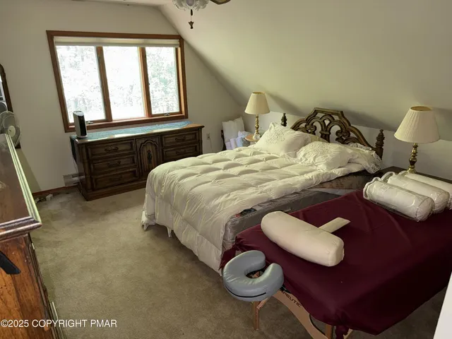 a bedroom with a bed and dresser