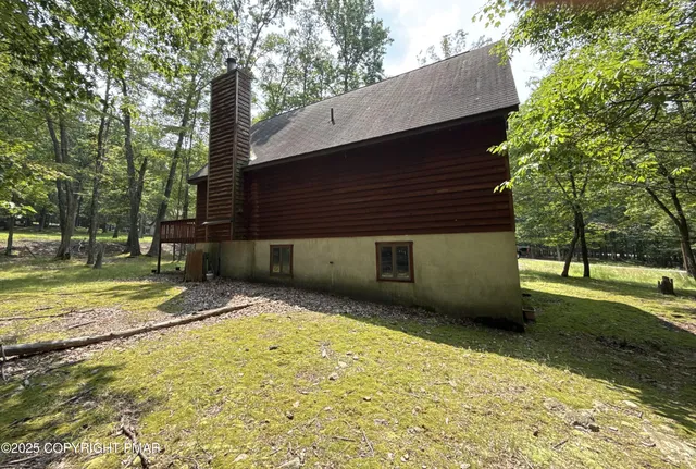 a backyard of a house with lots of green space