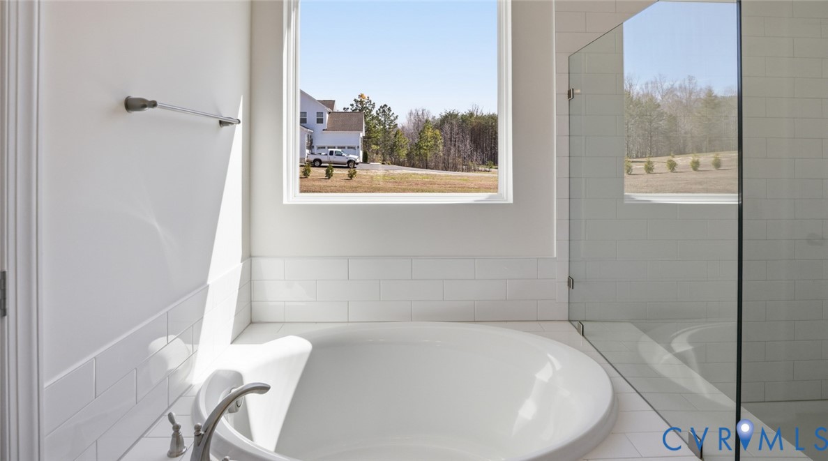 3726 Rocketts Ridge Drive Goochland, VA 23063 - Photo 21 of 38 The first-floor primary suite offers a luxurious r