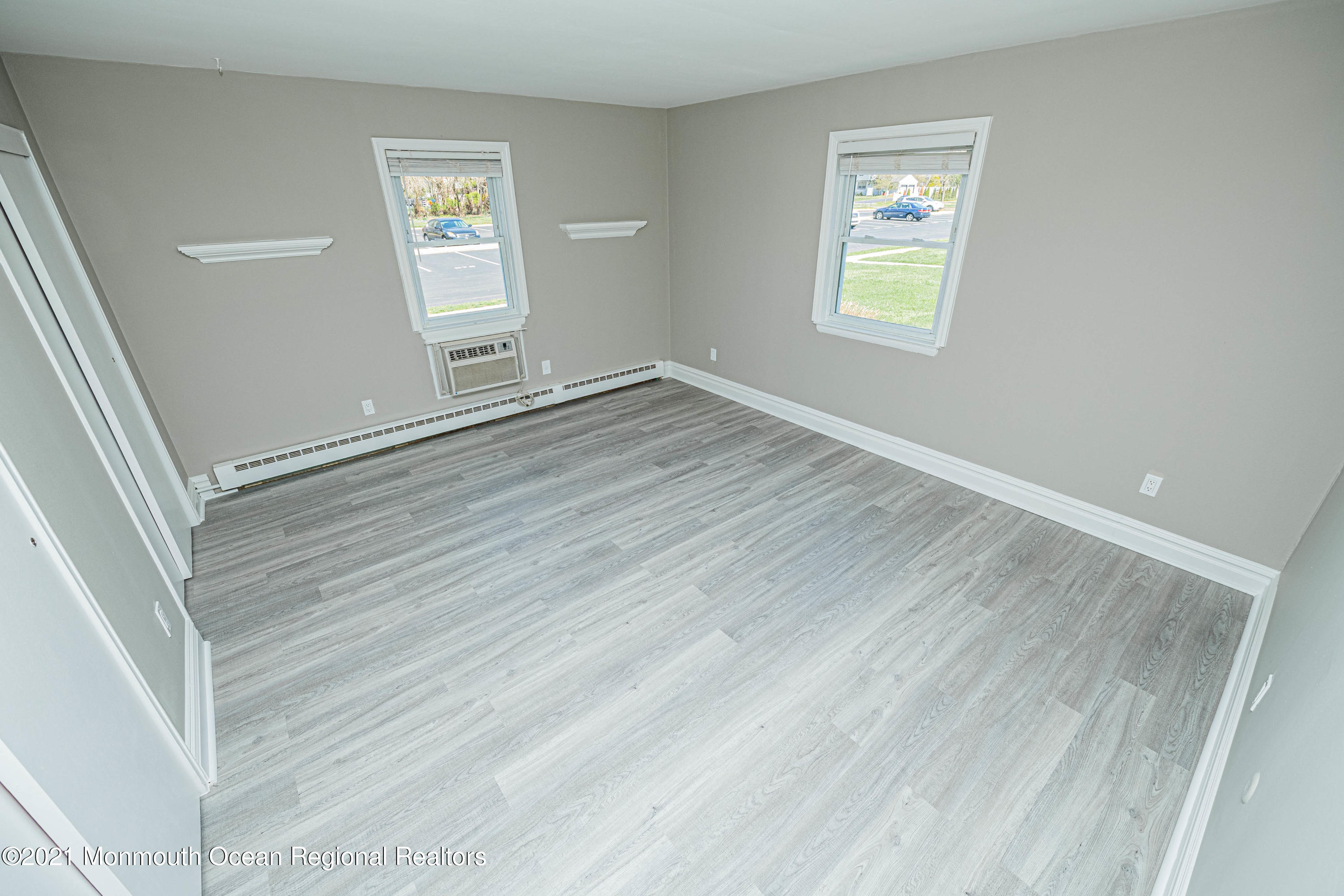 59 Stonehurst Boulevard, Unit B Freehold, NJ 07728 - Photo 20 of 25 a view of an empty room with a window