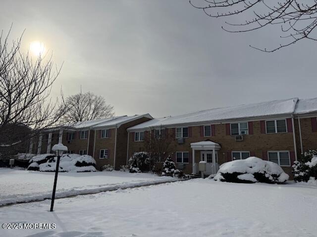 59 Stonehurst Boulevard, Unit B Freehold, NJ 07728 - Photo 22 of 25 a car parked in front of house