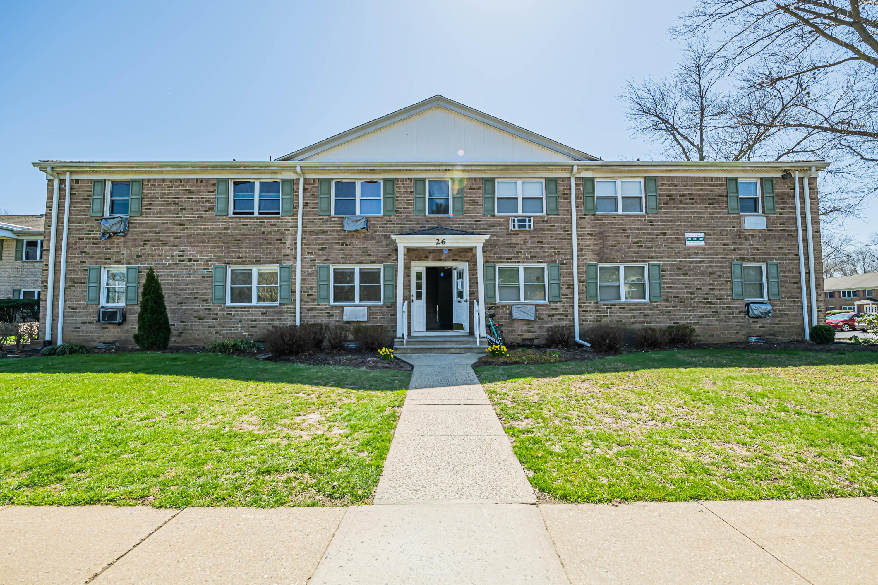 59 Stonehurst Boulevard, Unit B Freehold, NJ 07728 - Photo 24 of 25 a front view of a house with garden