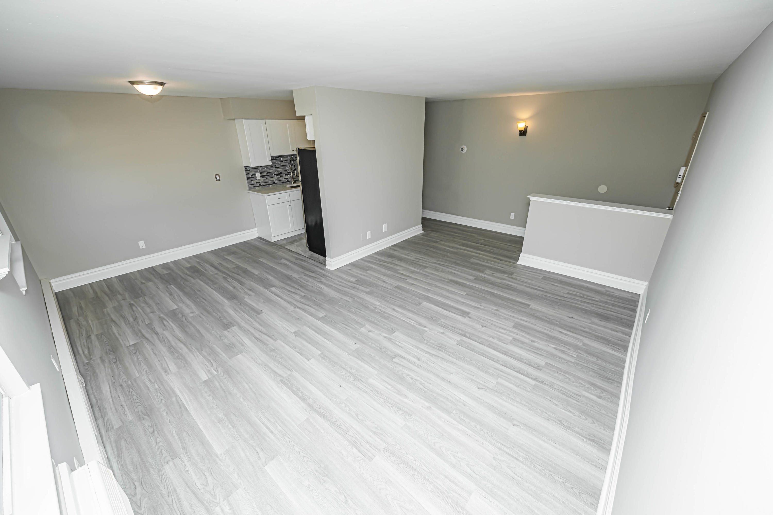 59 Stonehurst Boulevard, Unit B Freehold, NJ 07728 - Photo 8 of 25 wooden floor in an empty room