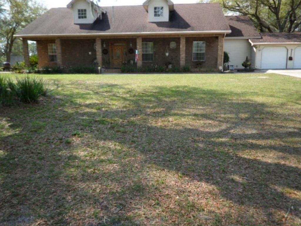 3504 Pittman Road Dover, FL 33527 - Photo 1 of 1 a front view of a house with a yard