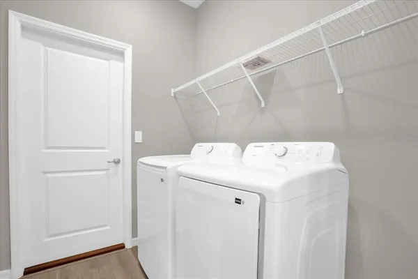a utility room with dryer and washer