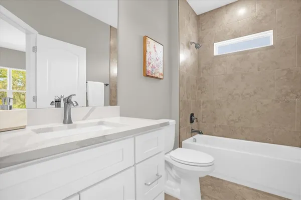 a bathroom with a sink a toilet and a bathtub