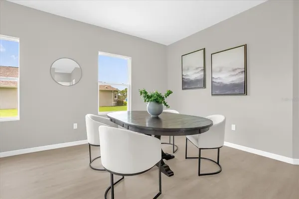 a dining room with furniture and window