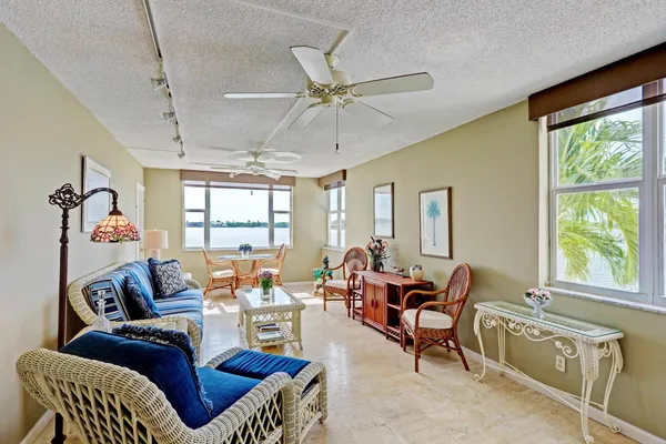 a kitchen with white cabinets and appliances