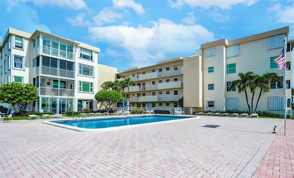 an aerial view of a house with a lake view
