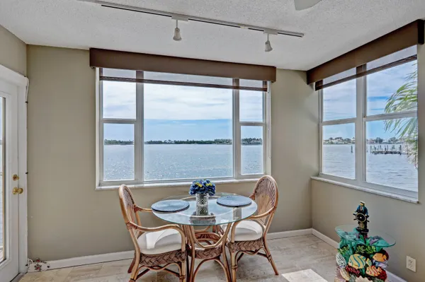 a view of a dining room with furniture window and outside view