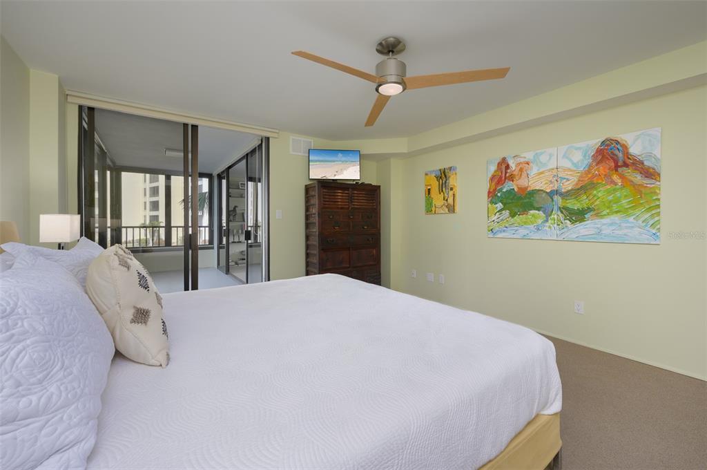 5780 Midnight Pass Road, Unit 210 Sarasota, FL 34242 - Photo 22 of 58 a bedroom with a bed and a large window