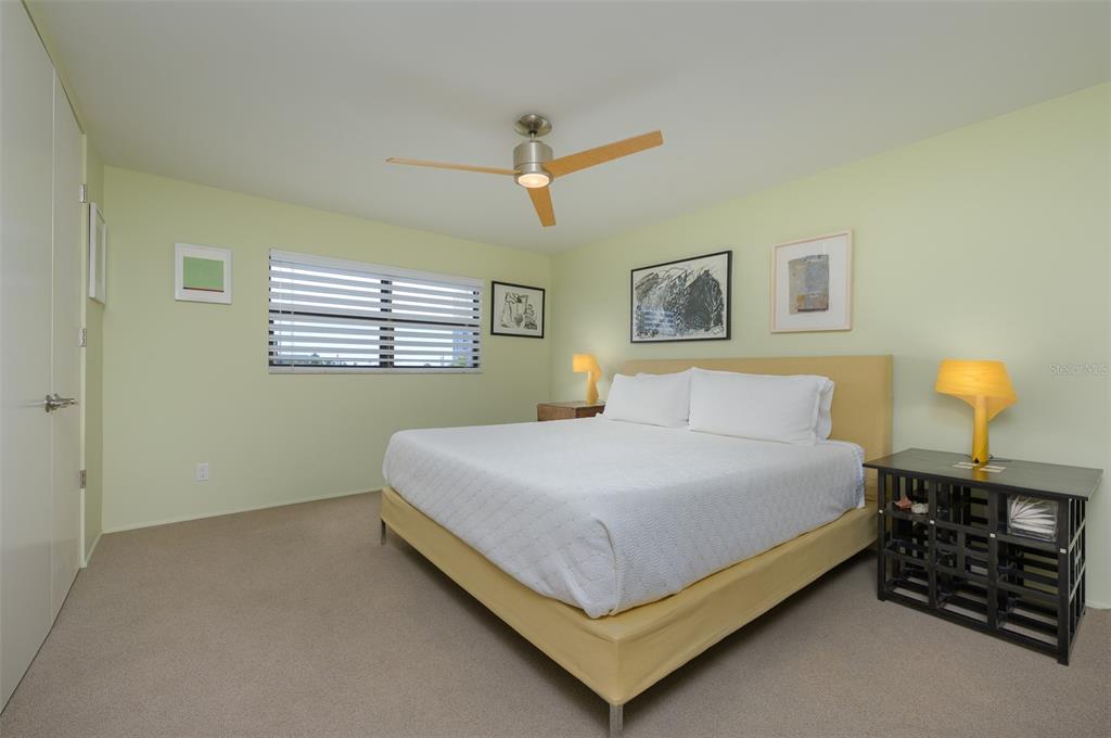 5780 Midnight Pass Road, Unit 210 Sarasota, FL 34242 - Photo 23 of 58 a bedroom with a bed and window