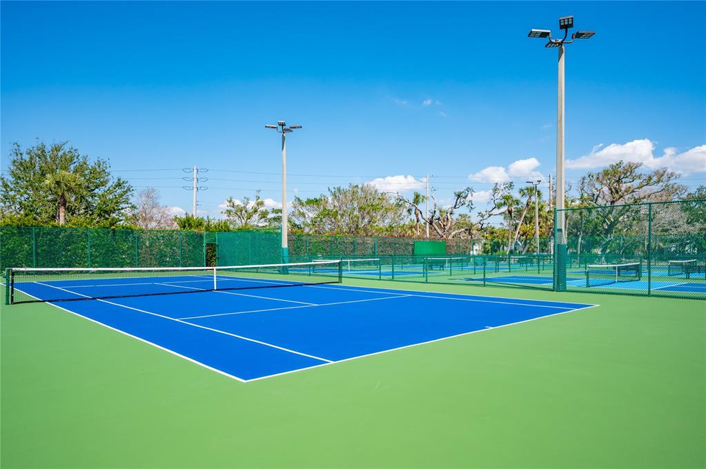 5780 Midnight Pass Road, Unit 210 Sarasota, FL 34242 - Photo 37 of 58 a view of a tennis court
