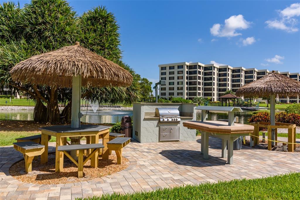 5780 Midnight Pass Road, Unit 210 Sarasota, FL 34242 - Photo 43 of 58 a view of an outdoor sitting area with furniture
